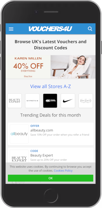 A phone with the Vouchers4U website on the screen